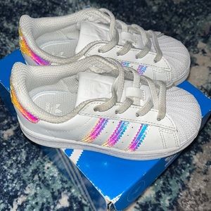 White Adidas with iridescent accent